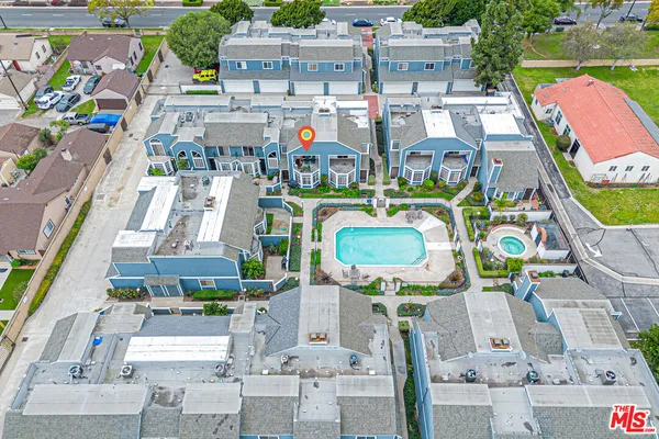 an aerial view of houses with outdoor space