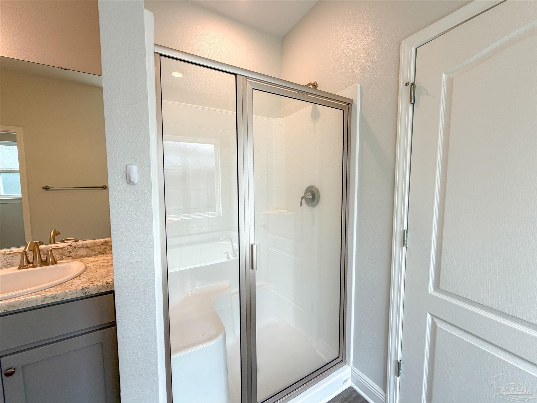 3613 Conley Drive Cantonment, FL 32533 - Photo 14 of 32 a bathroom with a shower and a sink