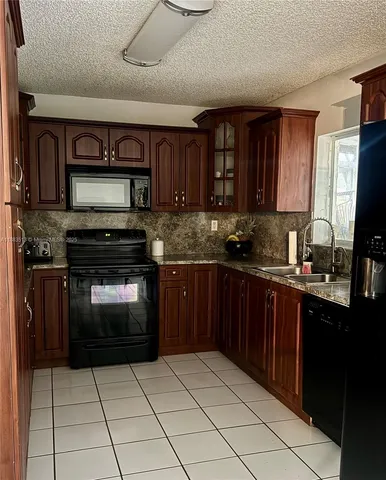 $620,000 | 9038 Northwest 193rd Terrace, Hialeah, FL 33018