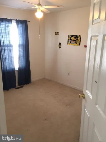 a view of a hallway with a window