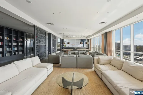 a living room with furniture and a large window