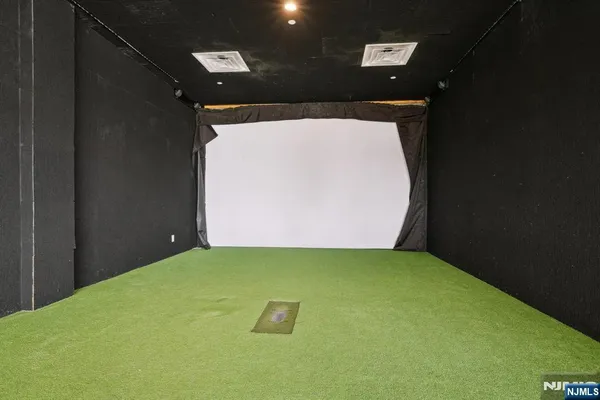 a living room with a couch and a hard wood floor
