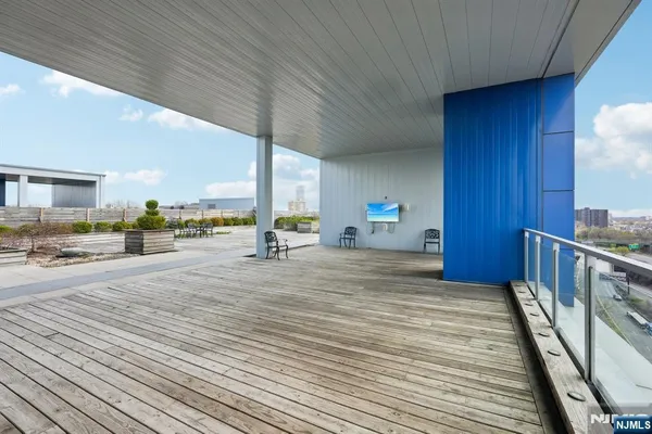 a view of a swimming pool and outdoor seating