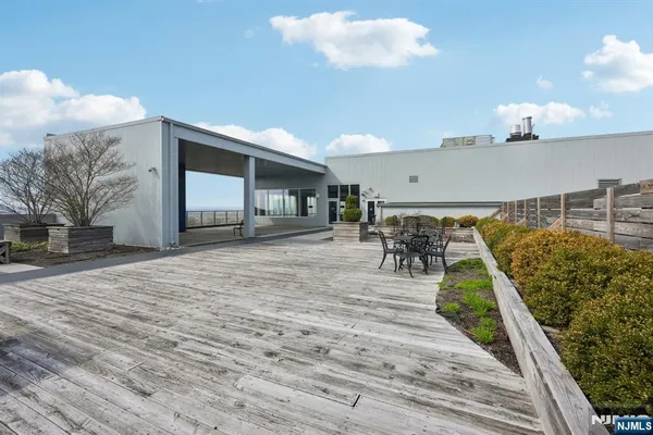 a view of a swimming pool and lounge chair