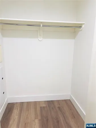 a view of a room with racks on the wall