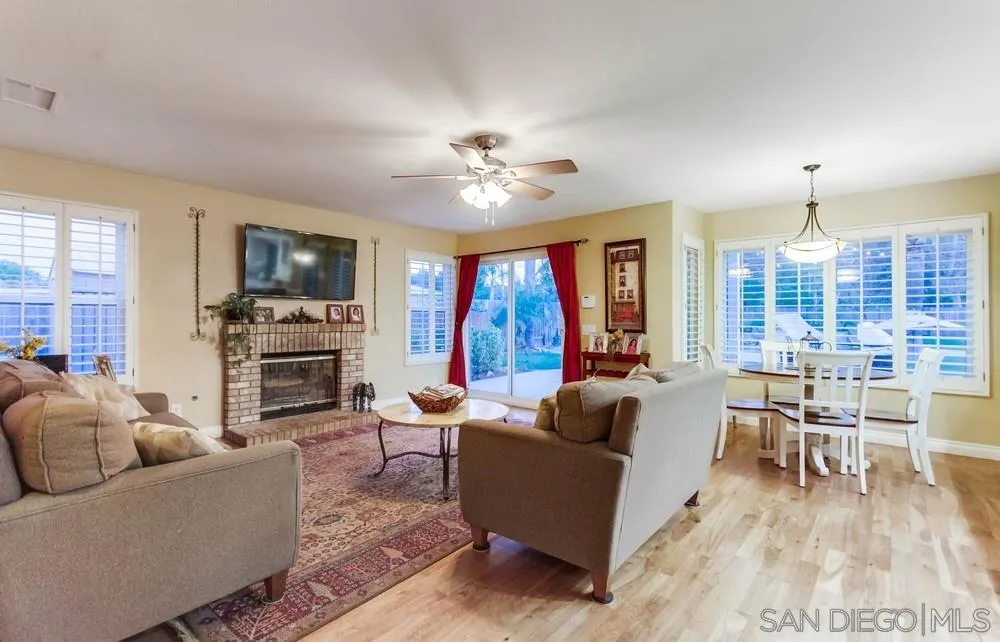 13919 Poway Valley Road Poway, CA 92064 - Photo 23 of 70 a living room with furniture a fireplace and a flat screen tv