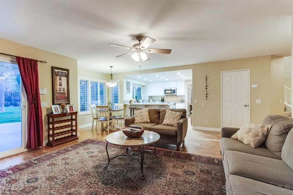13919 Poway Valley Road Poway, CA 92064 - Photo 24 of 70 a living room with furniture a ceiling fan and a window
