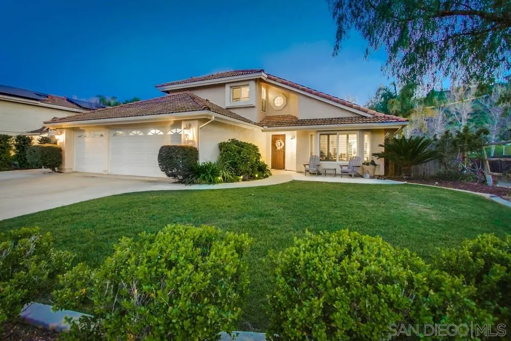 13919 Poway Valley Road Poway, CA 92064 - Photo 3 of 70 a front view of a house with a yard and trees