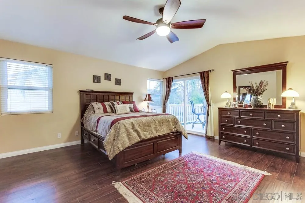13919 Poway Valley Road Poway, CA 92064 - Photo 35 of 70 a bedroom with a bed a dresser and a window