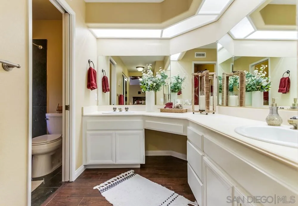 13919 Poway Valley Road Poway, CA 92064 - Photo 38 of 70 a bathroom with a sink and a mirror