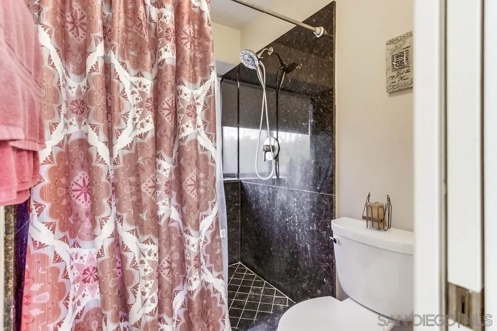13919 Poway Valley Road Poway, CA 92064 - Photo 40 of 70 a bathroom with a toilet and shower