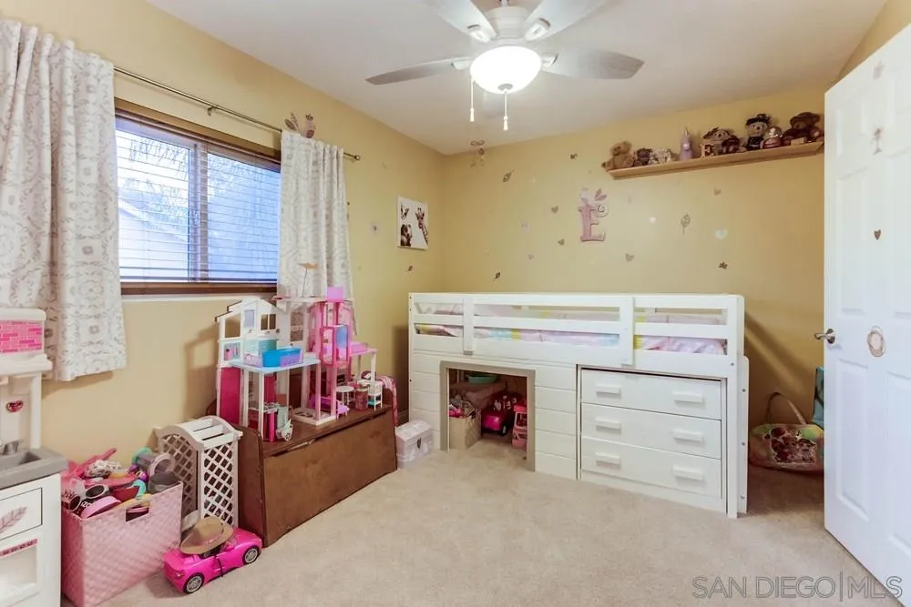 13919 Poway Valley Road Poway, CA 92064 - Photo 42 of 70 a room with a baby bed dresser and a window