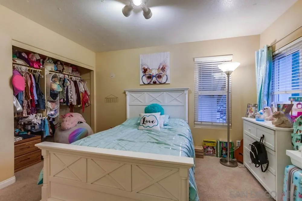 13919 Poway Valley Road Poway, CA 92064 - Photo 46 of 70 a bedroom with a bed a dresser and next to a window