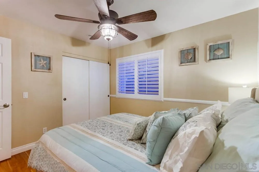 13919 Poway Valley Road Poway, CA 92064 - Photo 49 of 70 a bedroom with a bed and a window