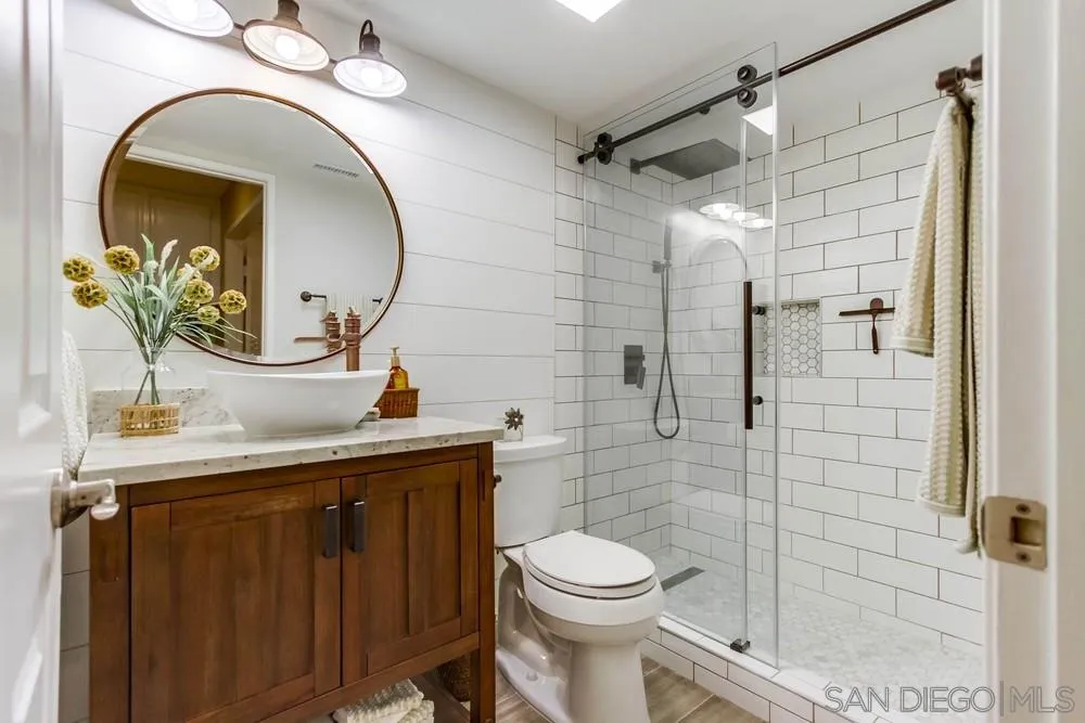 13919 Poway Valley Road Poway, CA 92064 - Photo 51 of 70 a bathroom with a sink a toilet and shower