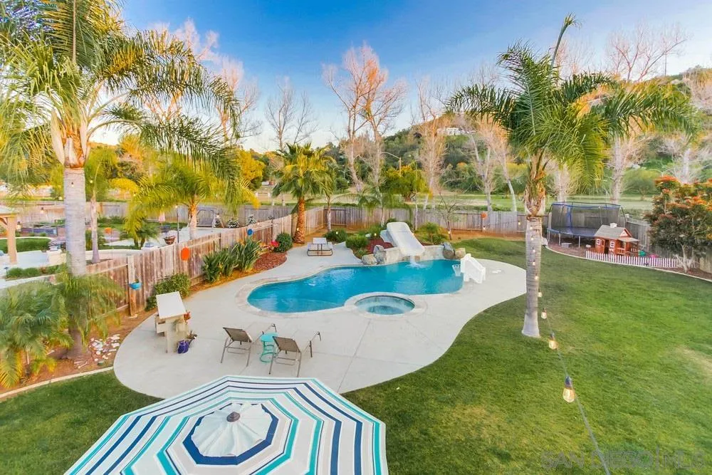13919 Poway Valley Road Poway, CA 92064 - Photo 68 of 70 a view of a swimming pool with an outdoor seating