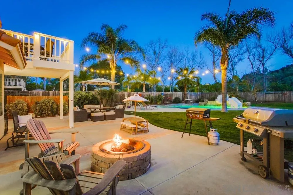 13919 Poway Valley Road Poway, CA 92064 - Photo 7 of 70 a view of a swimming pool with a patio and a yard