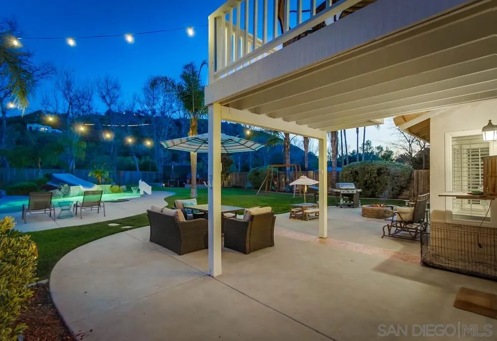 13919 Poway Valley Road Poway, CA 92064 - Photo 10 of 70 a view of a patio with couches table and chairs and potted plants