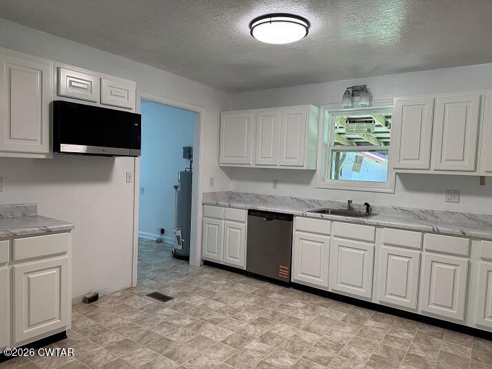 5 Clearview Avenue Trezevant, TN 38258 - Photo 4 of 17 a kitchen with granite countertop a sink and a stove top oven