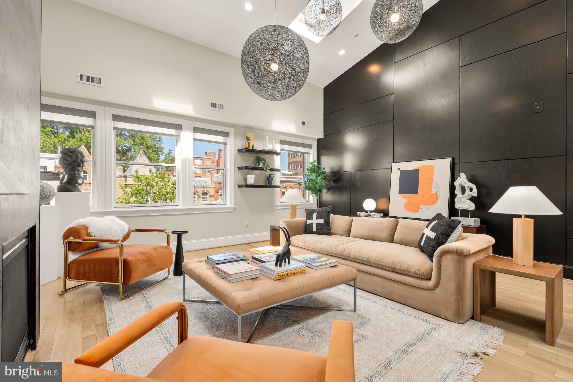 2431 Ontario Road Northwest, Unit 4 Washington, DC 20009 - Photo 11 of 48 a living room with furniture and a large window
