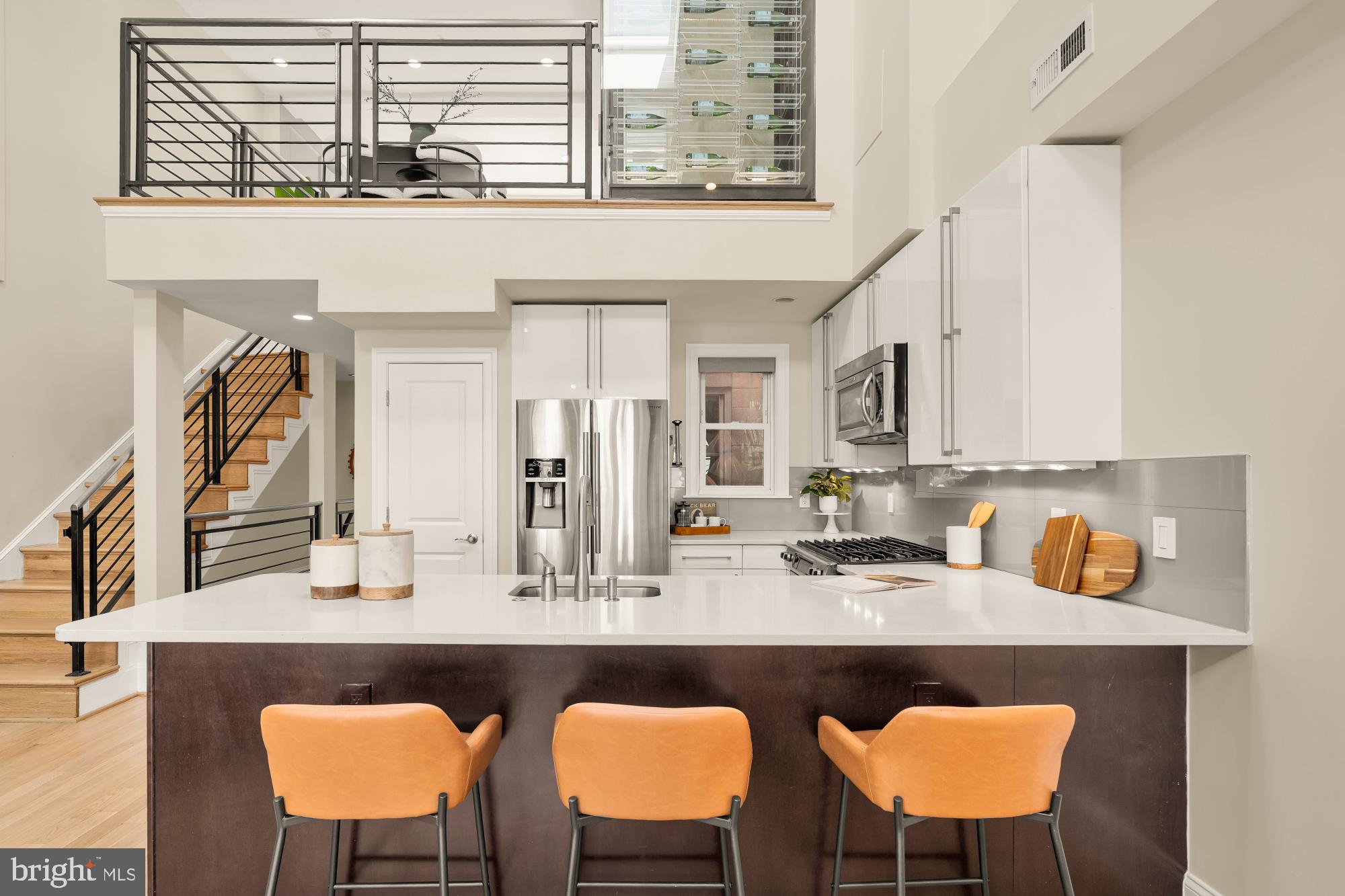 2431 Ontario Road Northwest, Unit 4 Washington, DC 20009 - Photo 12 of 48 a dining table chairs next to a window