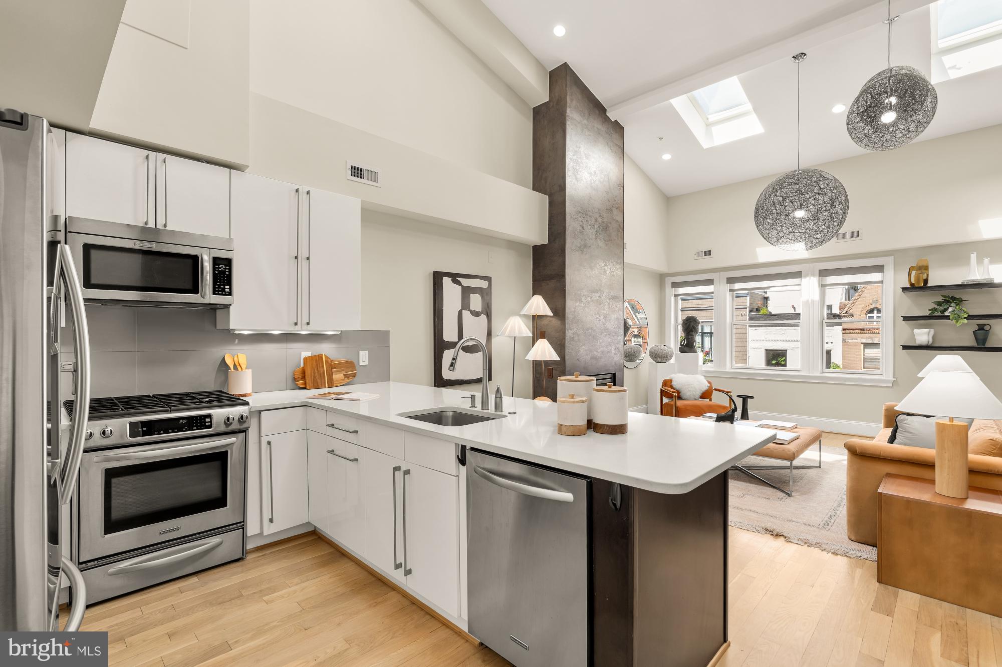 2431 Ontario Road Northwest, Unit 4 Washington, DC 20009 - Photo 14 of 48 a kitchen with a stove a sink and a refrigerator