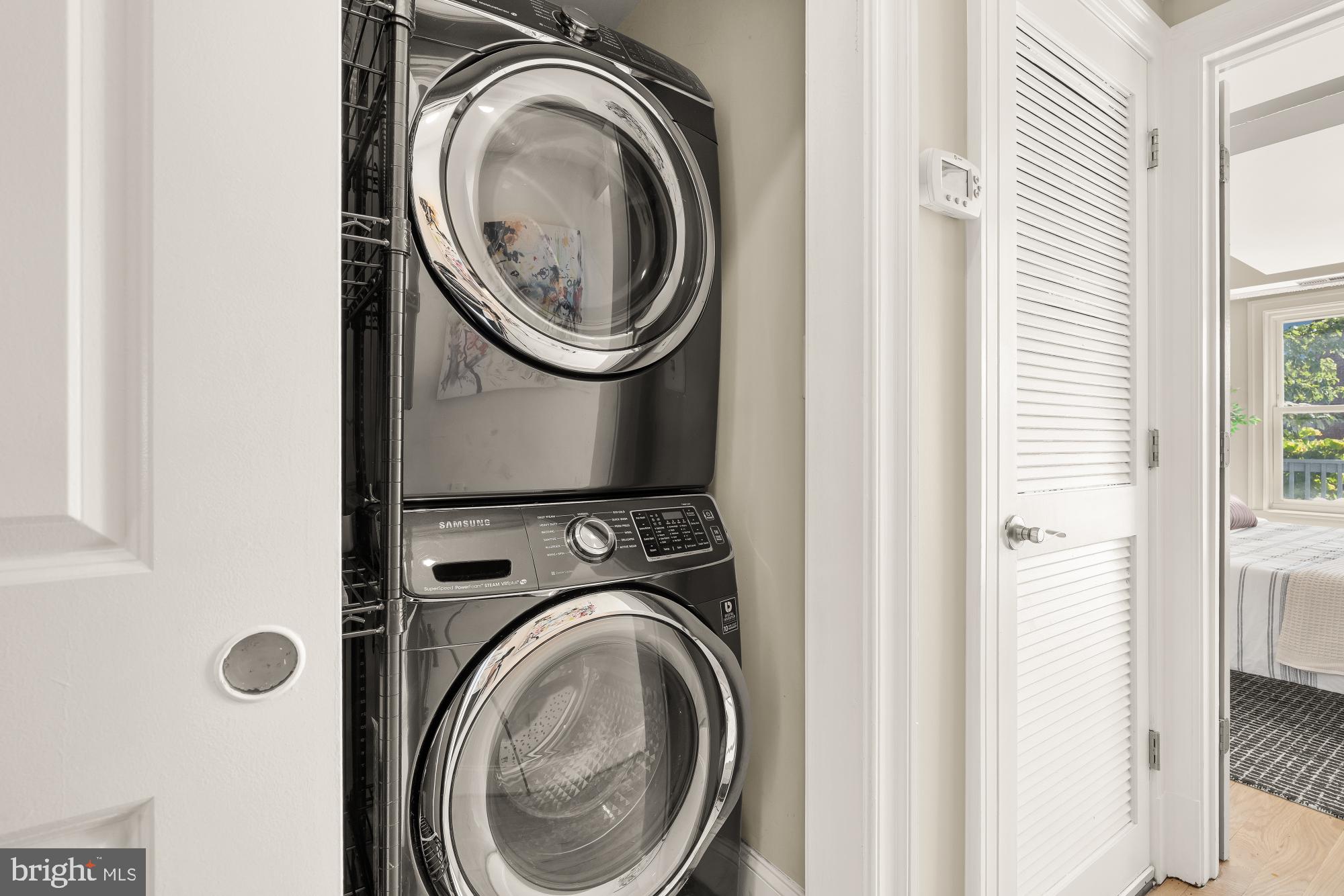 2431 Ontario Road Northwest, Unit 4 Washington, DC 20009 - Photo 19 of 48 a utility room with dryer and washer