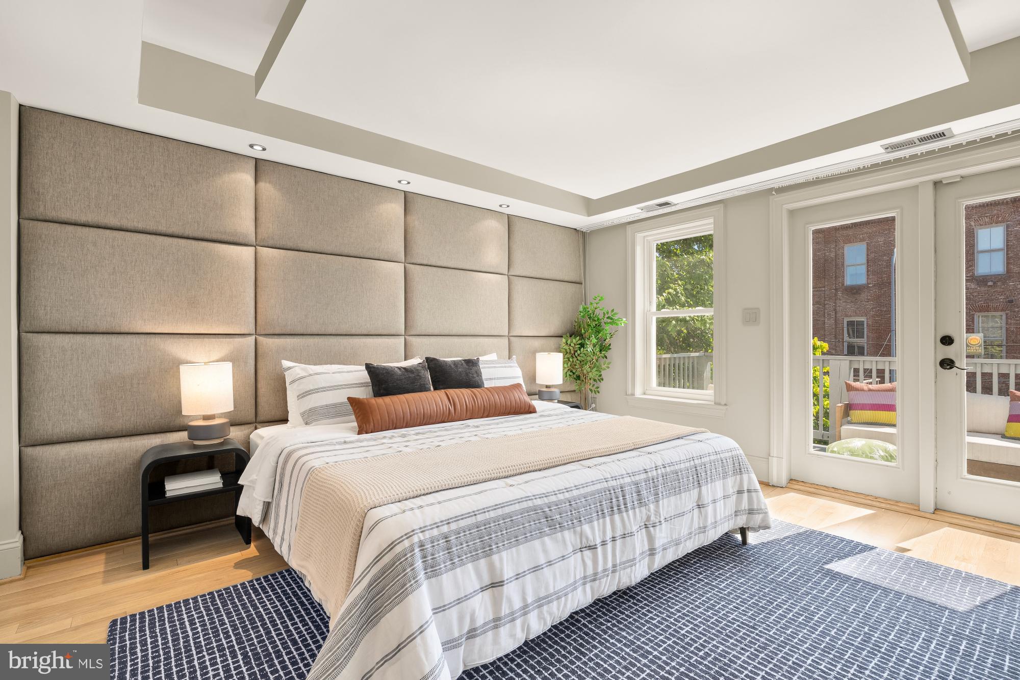 2431 Ontario Road Northwest, Unit 4 Washington, DC 20009 - Photo 20 of 48 a bedroom with a large bed and a window