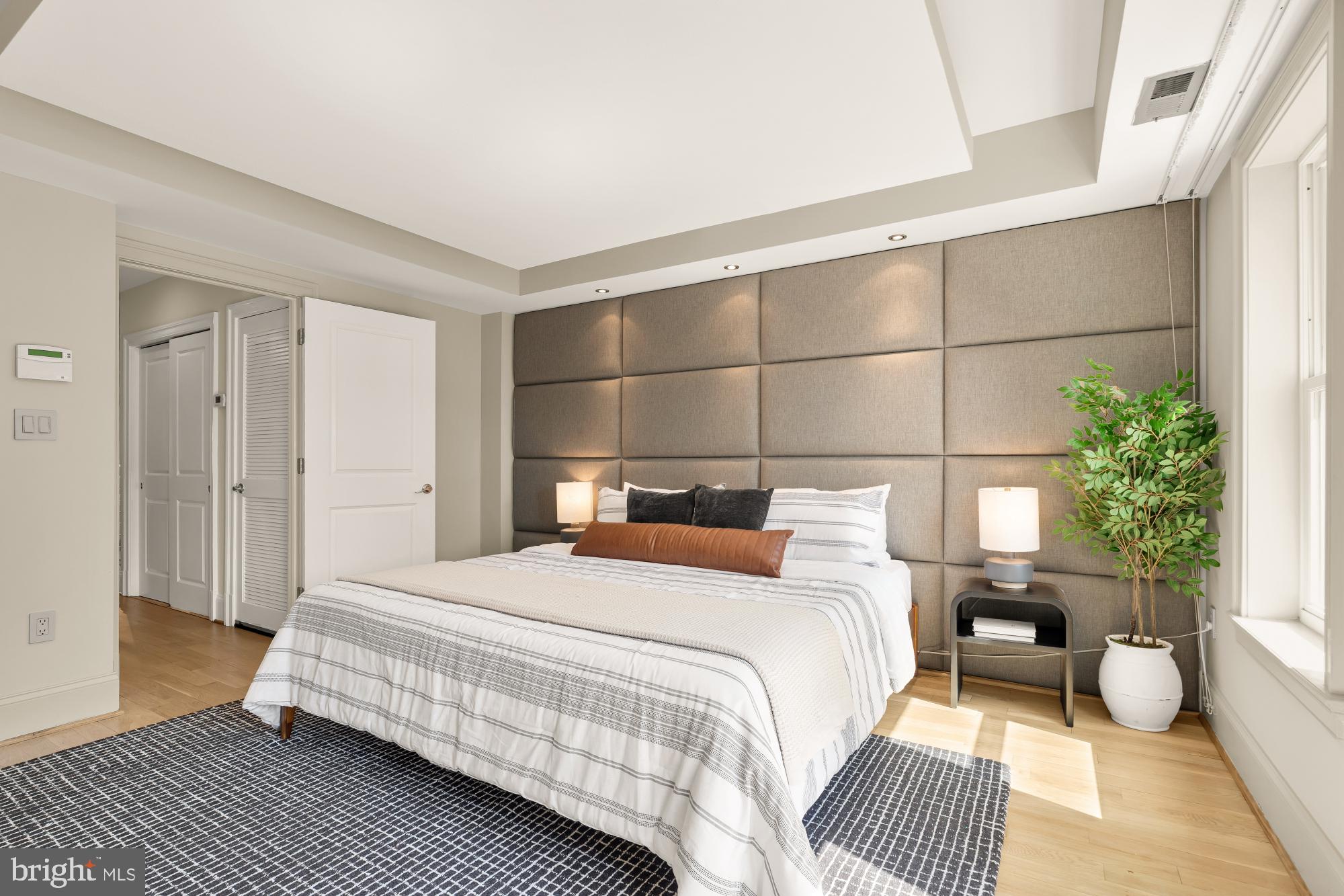 2431 Ontario Road Northwest, Unit 4 Washington, DC 20009 - Photo 22 of 48 a bedroom with a bed and a window