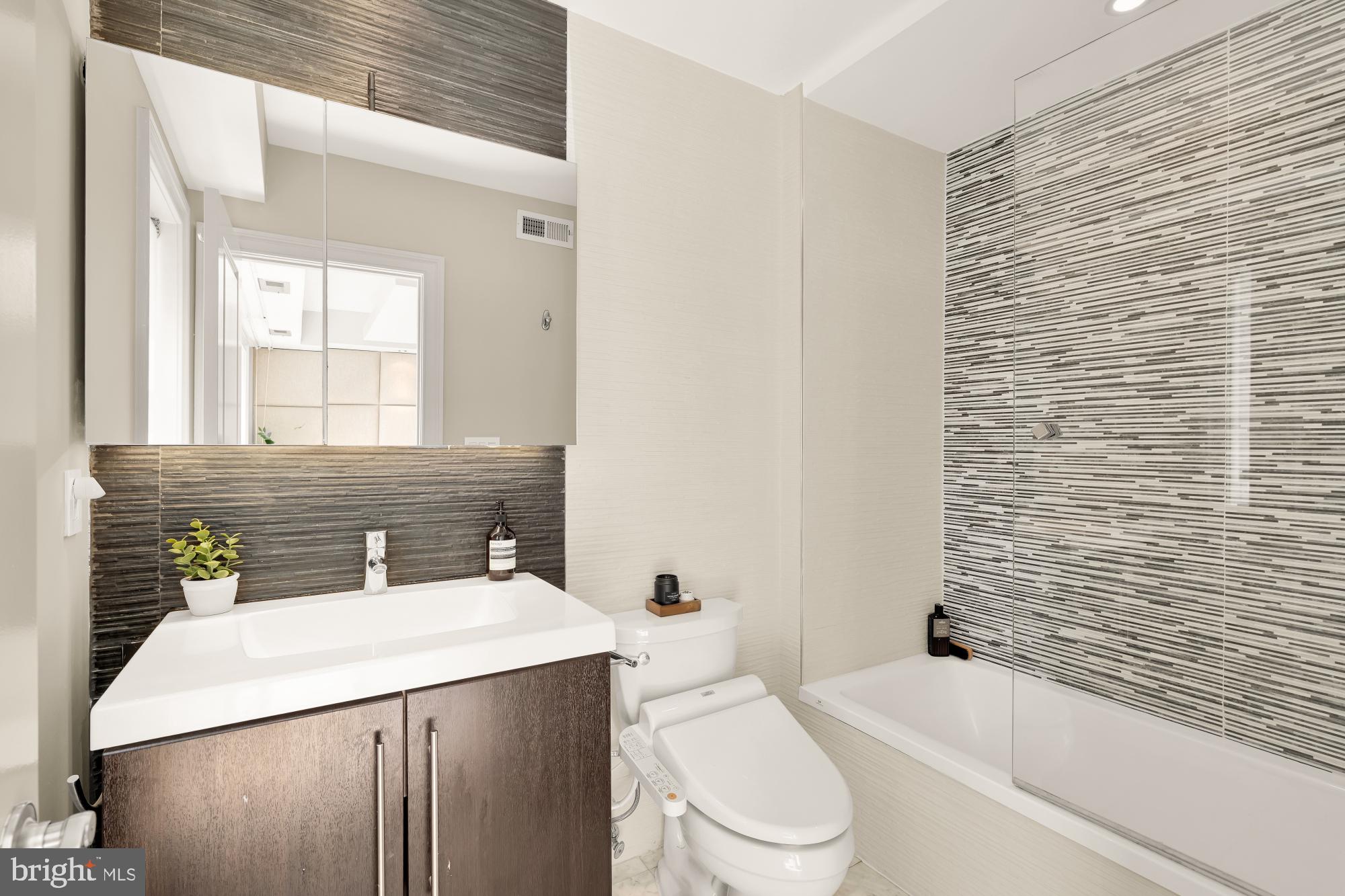 2431 Ontario Road Northwest, Unit 4 Washington, DC 20009 - Photo 24 of 48 a bathroom with a sink a toilet and shower
