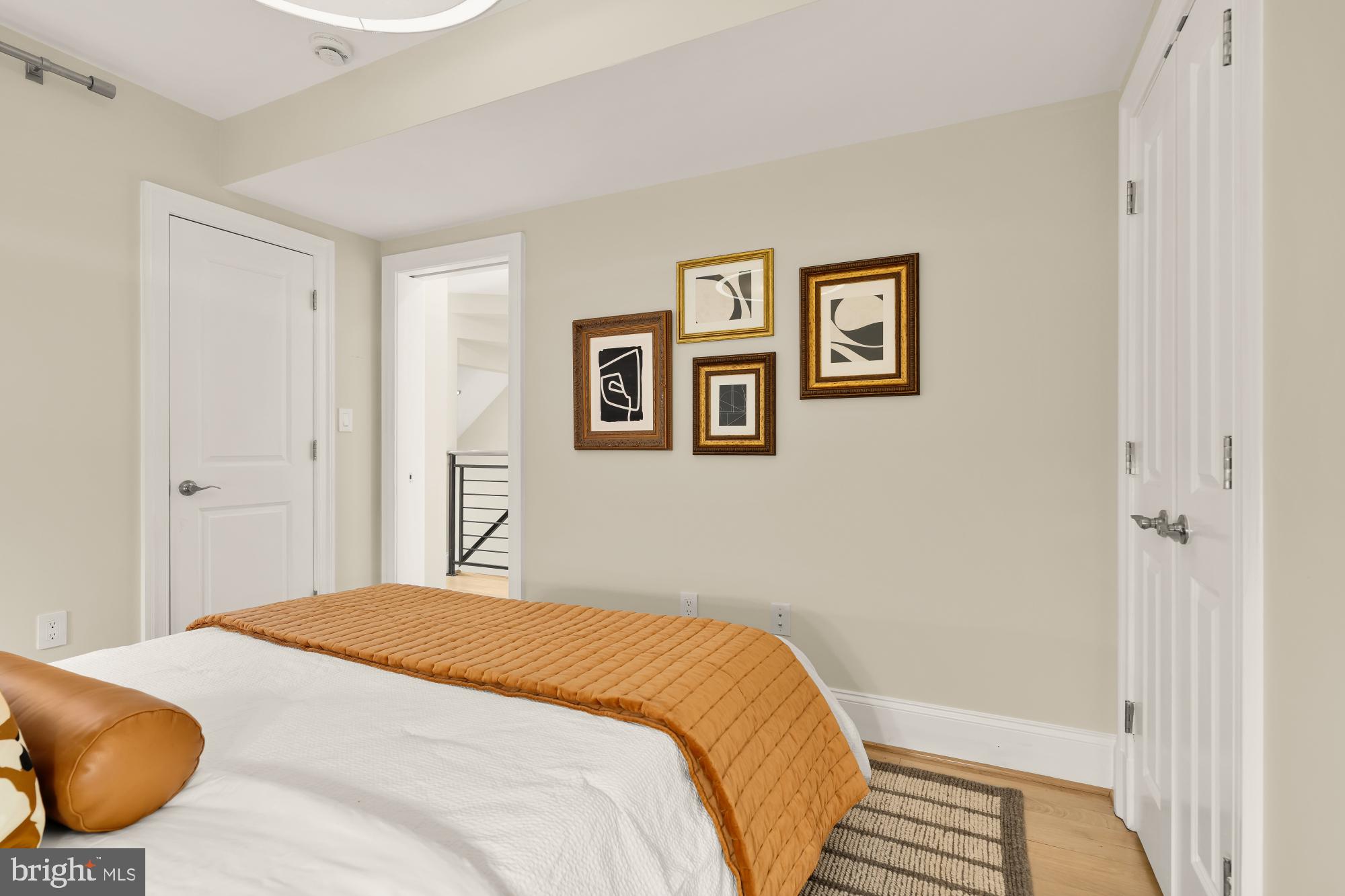 2431 Ontario Road Northwest, Unit 4 Washington, DC 20009 - Photo 28 of 48 a bedroom with a bed and painting on the wall