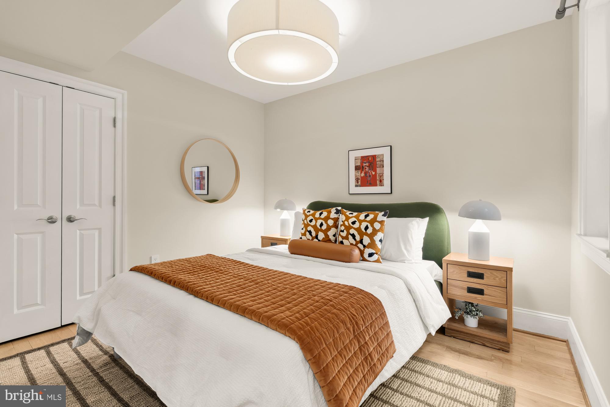 2431 Ontario Road Northwest, Unit 4 Washington, DC 20009 - Photo 29 of 48 a bedroom with a bed and a window