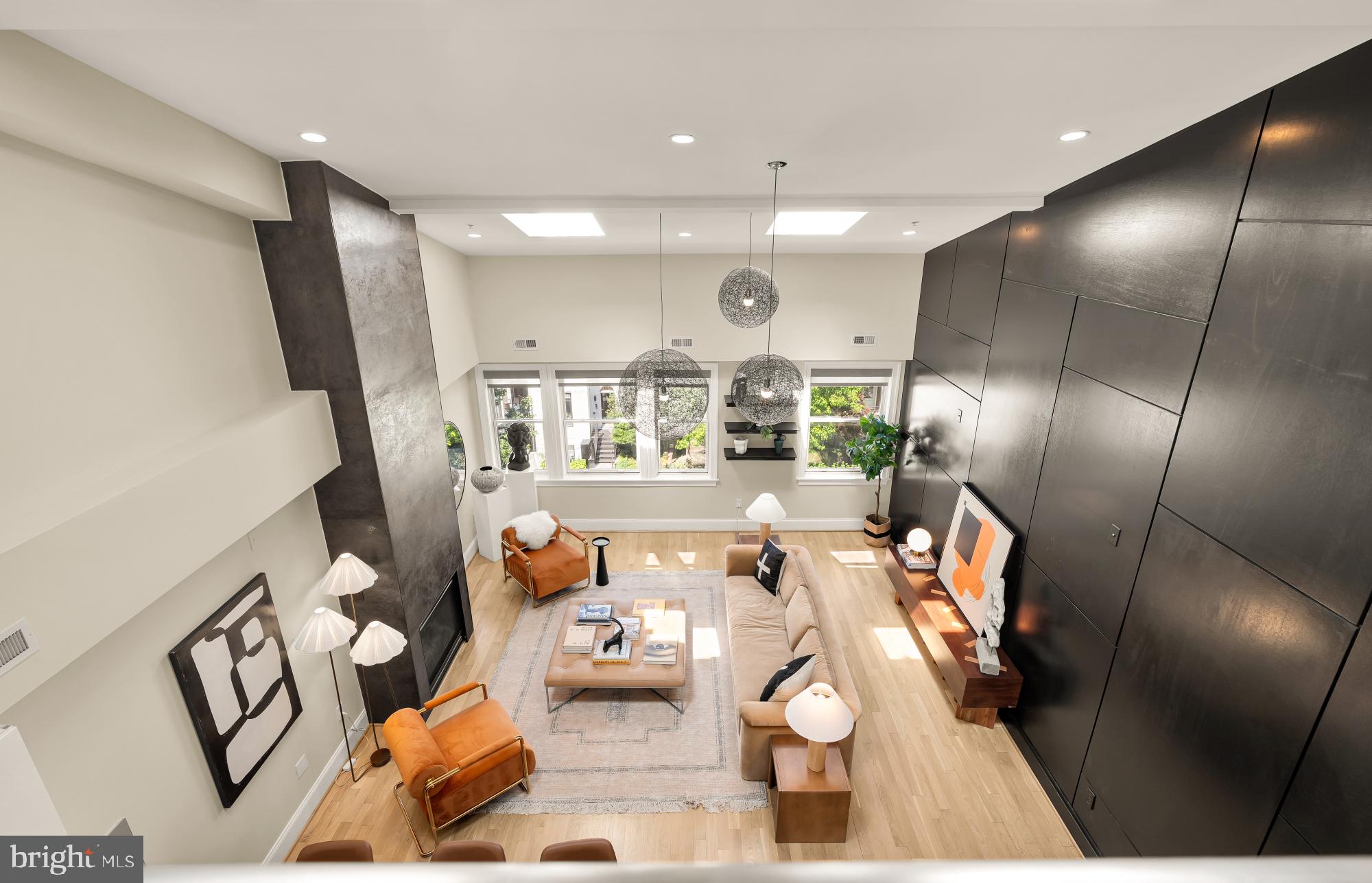 2431 Ontario Road Northwest, Unit 4 Washington, DC 20009 - Photo 34 of 48 a living room with furniture and a large mirror