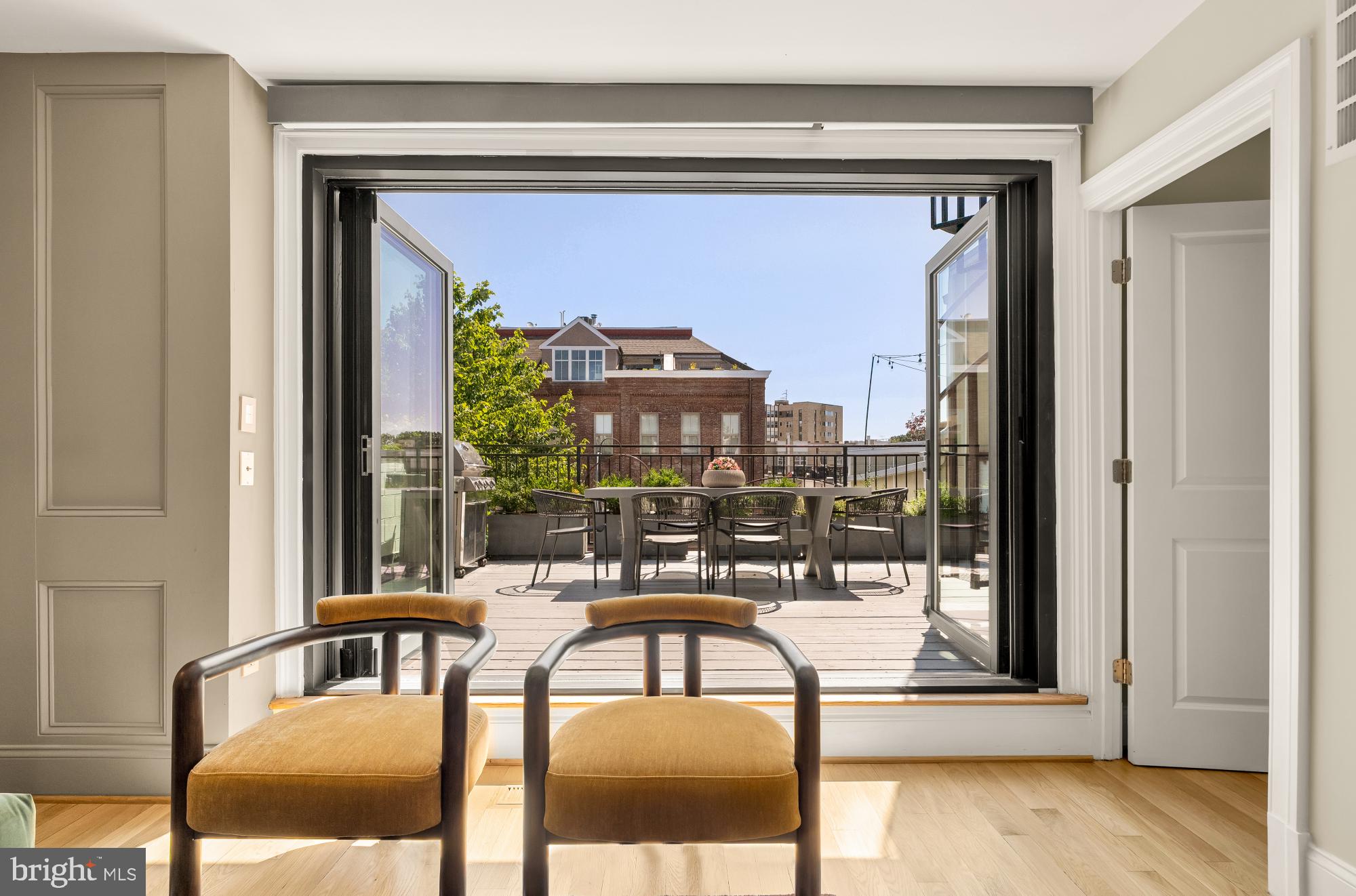 2431 Ontario Road Northwest, Unit 4 Washington, DC 20009 - Photo 41 of 48 a view of a balcony dining table and chairs
