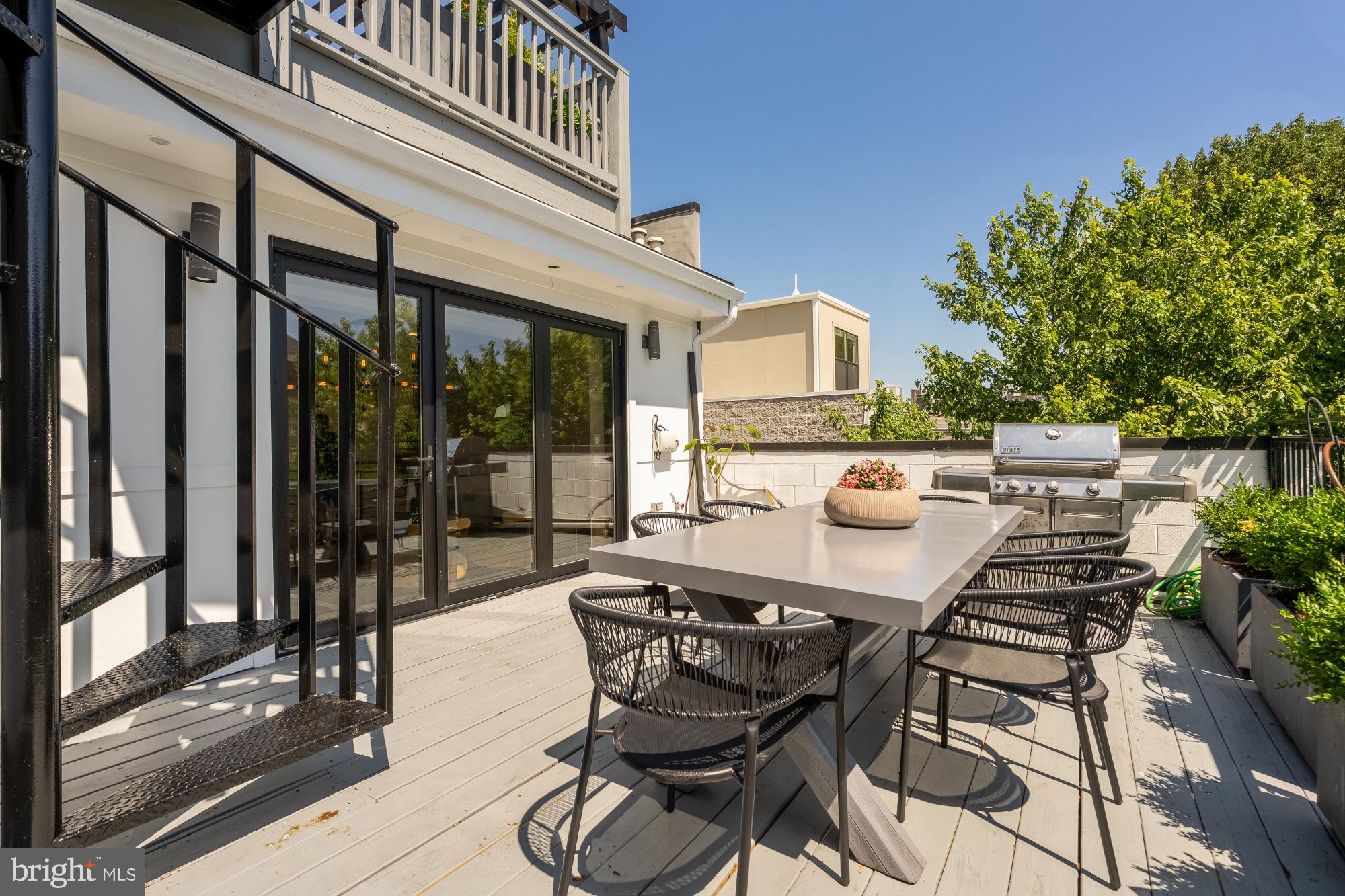 2431 Ontario Road Northwest, Unit 4 Washington, DC 20009 - Photo 44 of 48 a patio with table and chairs