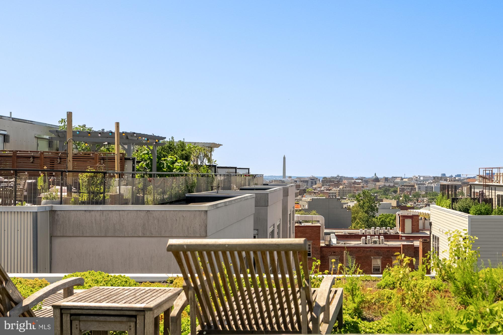 2431 Ontario Road Northwest, Unit 4 Washington, DC 20009 - Photo 46 of 48 a view of a balcony with two chairs and a table