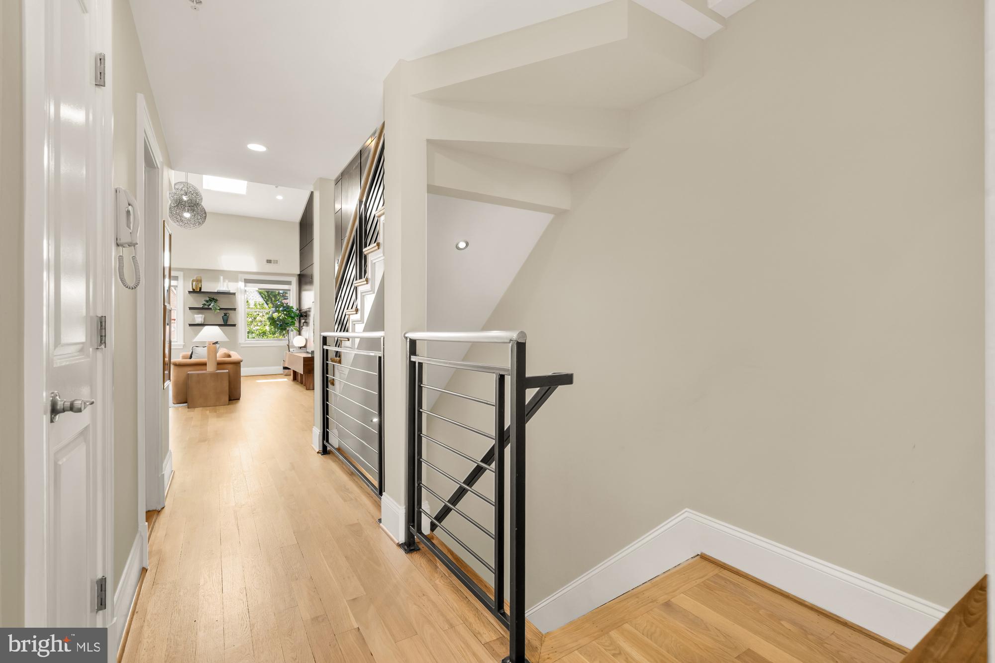2431 Ontario Road Northwest, Unit 4 Washington, DC 20009 - Photo 5 of 48 a view of a hallway with wooden floor and a bathroom