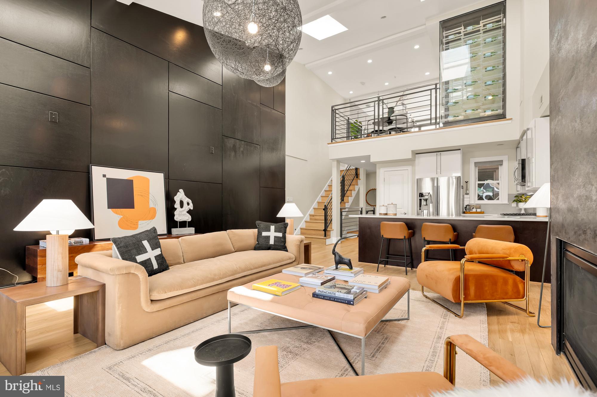 2431 Ontario Road Northwest, Unit 4 Washington, DC 20009 - Photo 6 of 48 a living room with furniture a rug and a chandelier