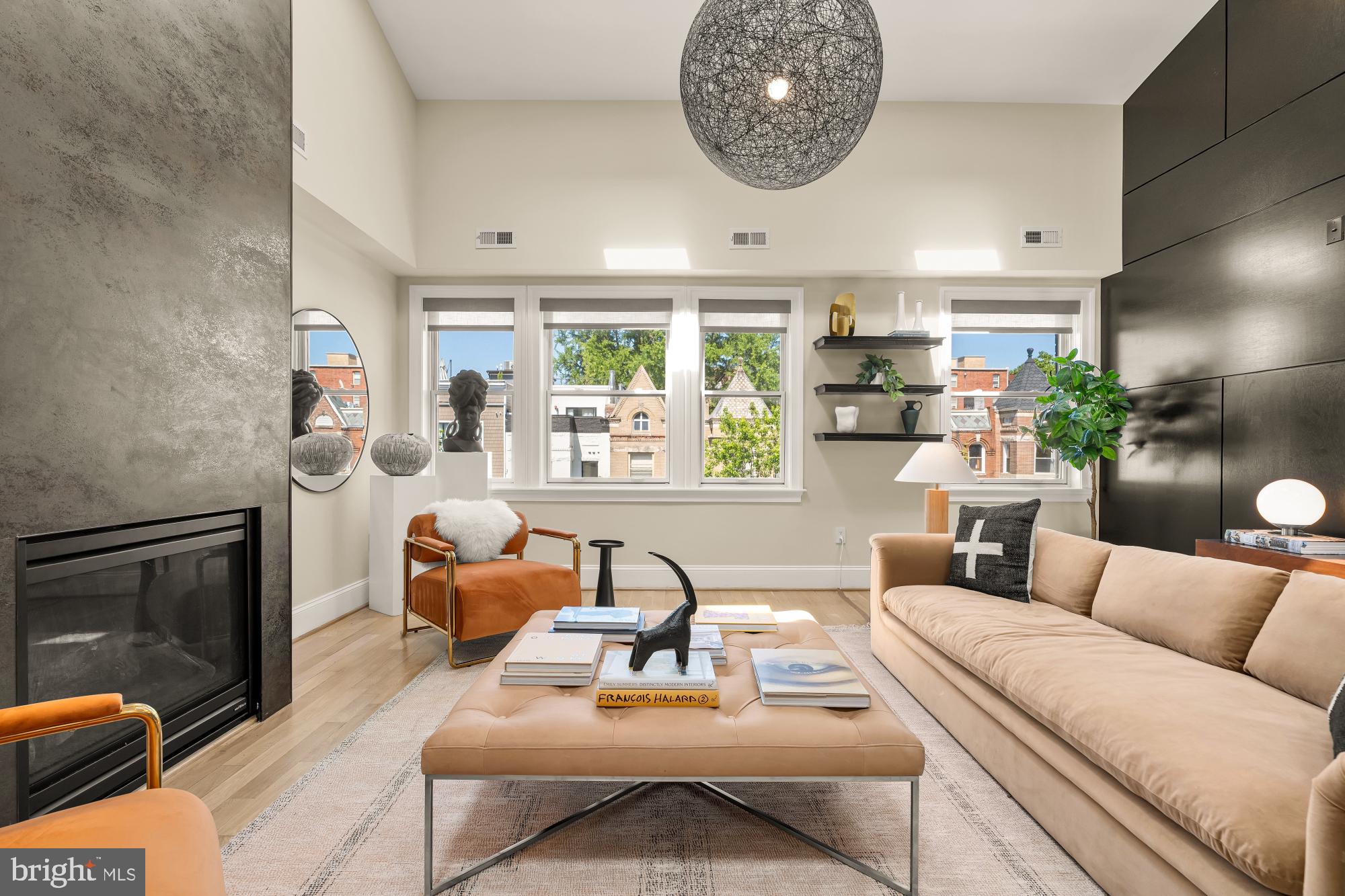 2431 Ontario Road Northwest, Unit 4 Washington, DC 20009 - Photo 7 of 48 a living room with furniture and a fireplace