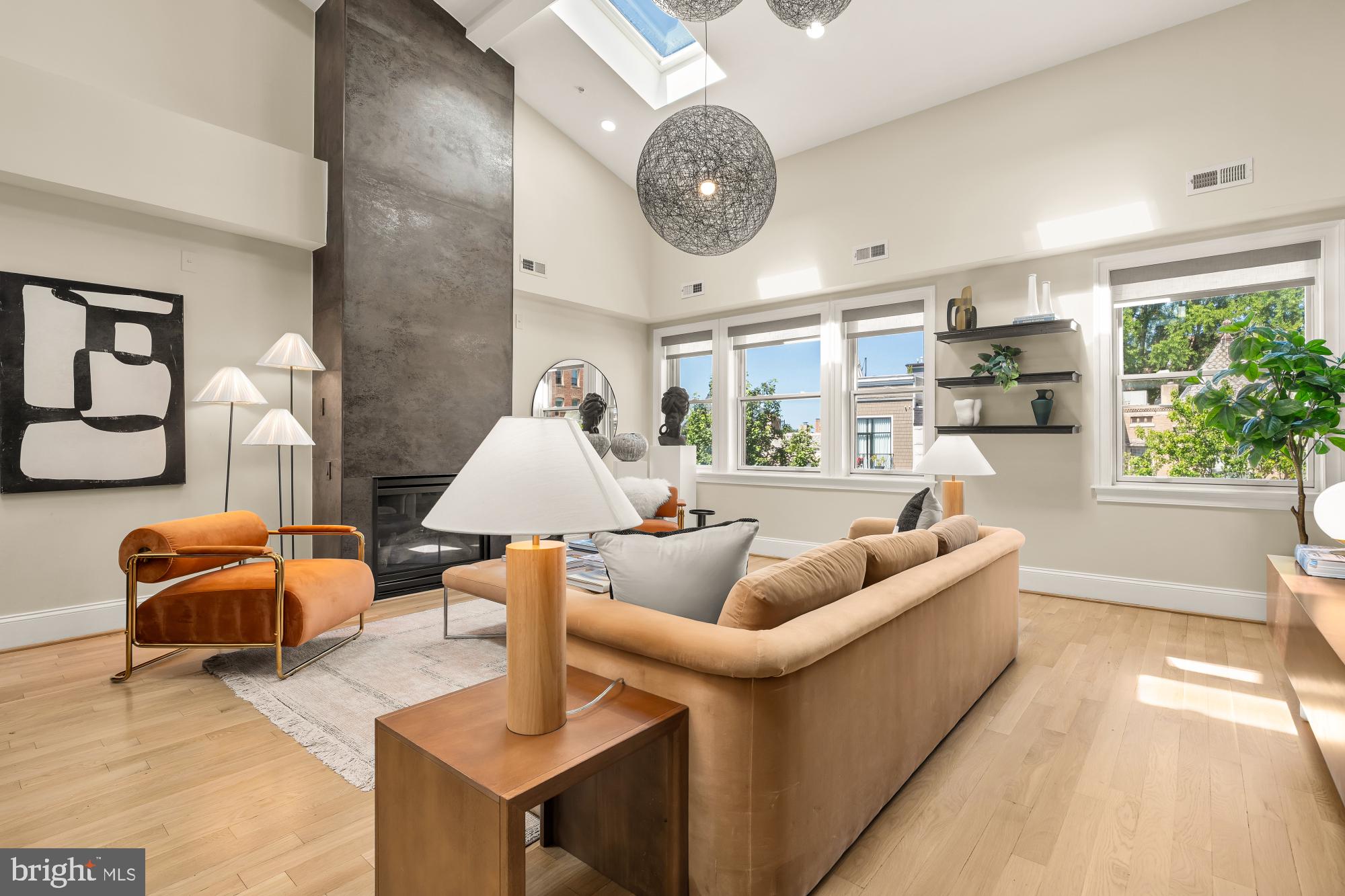 2431 Ontario Road Northwest, Unit 4 Washington, DC 20009 - Photo 10 of 48 a living room with furniture and a large window