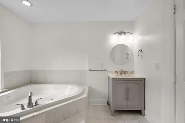 a bathroom with a bathtub and shower