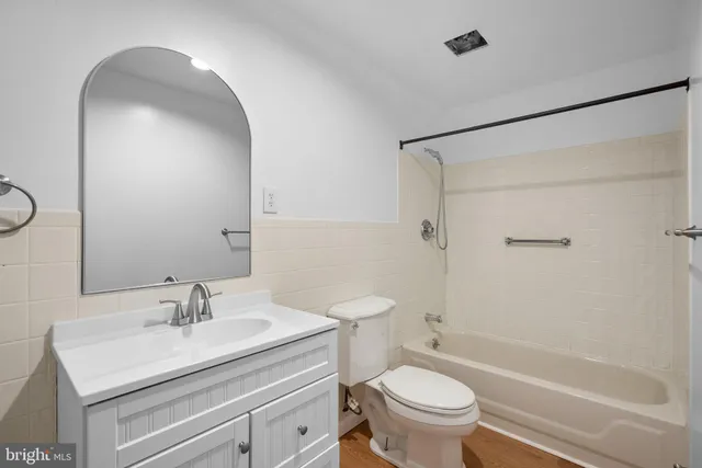 a bathroom with a bathtub and a toilet