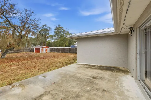 a house view with a backyard