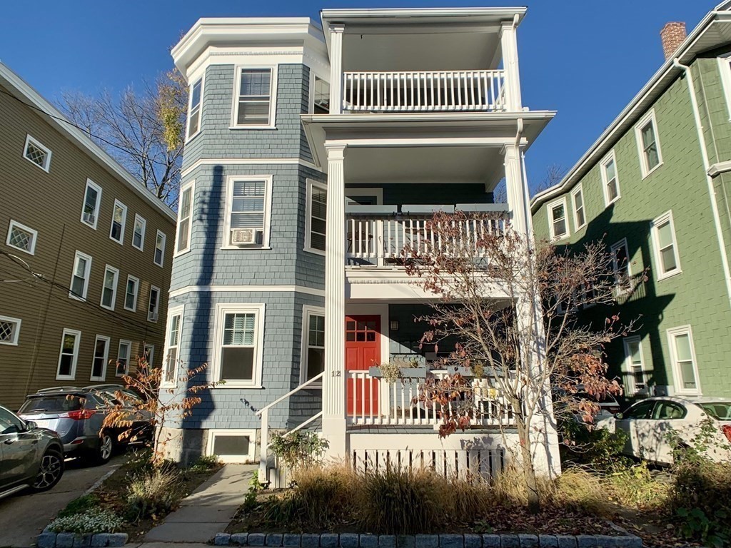 12 Rosemary Street, Unit 1 Boston, MA 02130 - Photo 1 of 17 a front view of a building with a yard