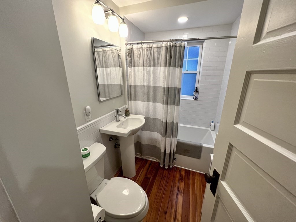 12 Rosemary Street, Unit 1 Boston, MA 02130 - Photo 11 of 17 a bathroom with a sink toilet and shower