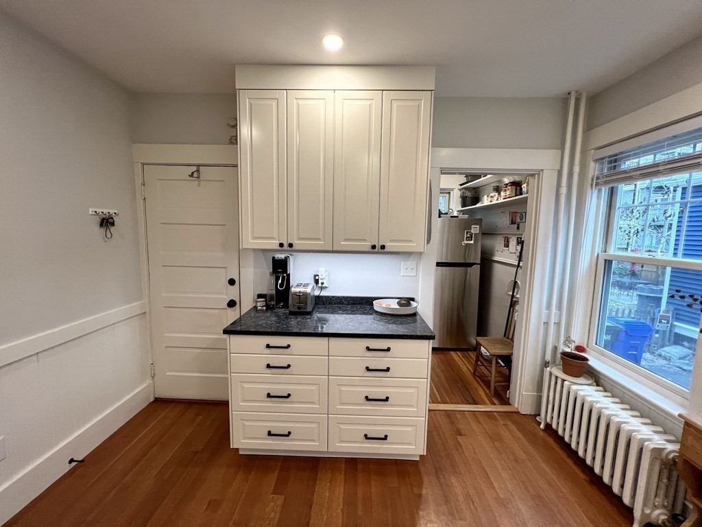 12 Rosemary Street, Unit 1 Boston, MA 02130 - Photo 14 of 17 a kitchen with stainless steel appliances a stove and a refrigerator