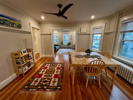 a very nice looking dining room with a rug