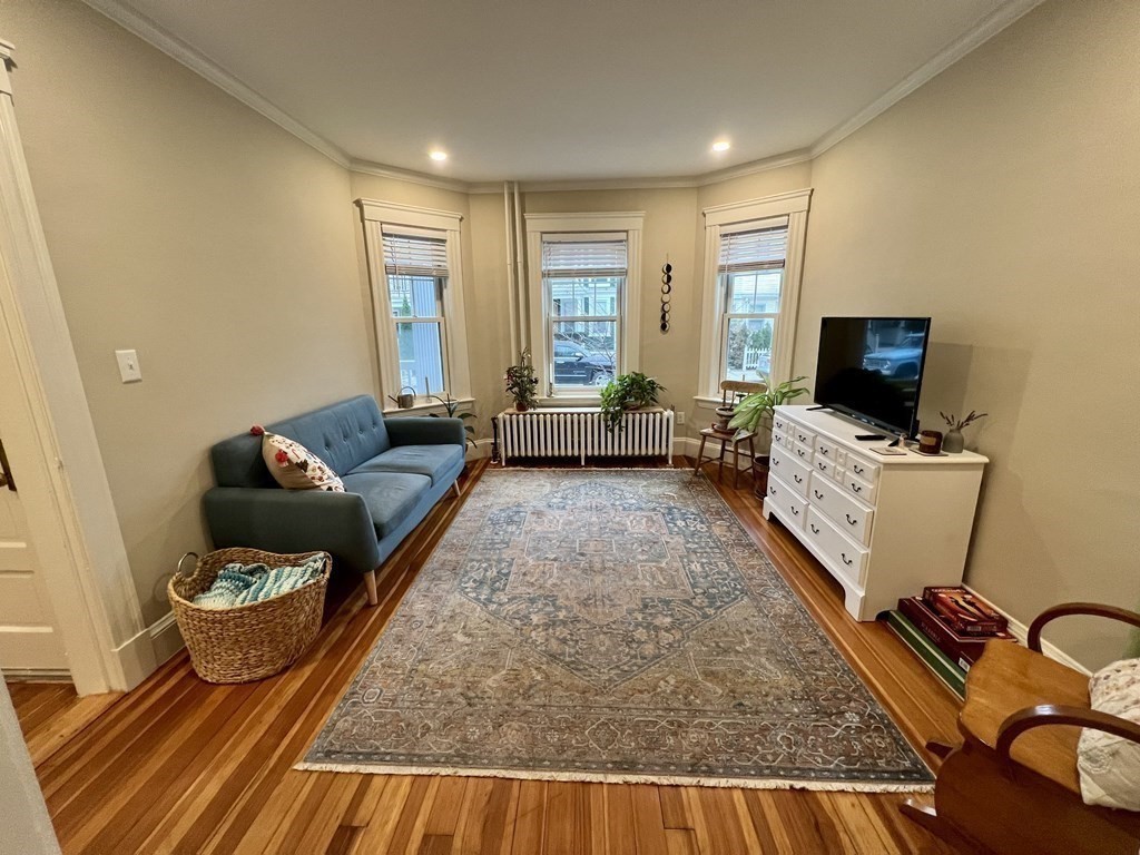 12 Rosemary Street, Unit 1 Boston, MA 02130 - Photo 3 of 17 a living room with furniture and a flat screen tv