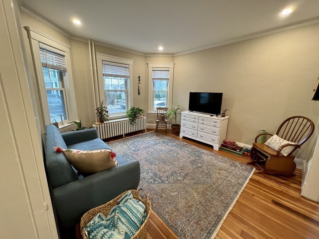 12 Rosemary Street, Unit 1 Boston, MA 02130 - Photo 4 of 17 a living room with furniture and a flat screen tv