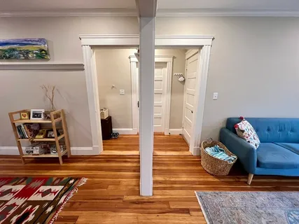 a living room with furniture and a rug